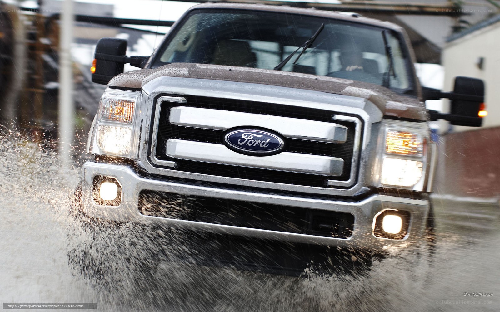 Ford truck driving through flood