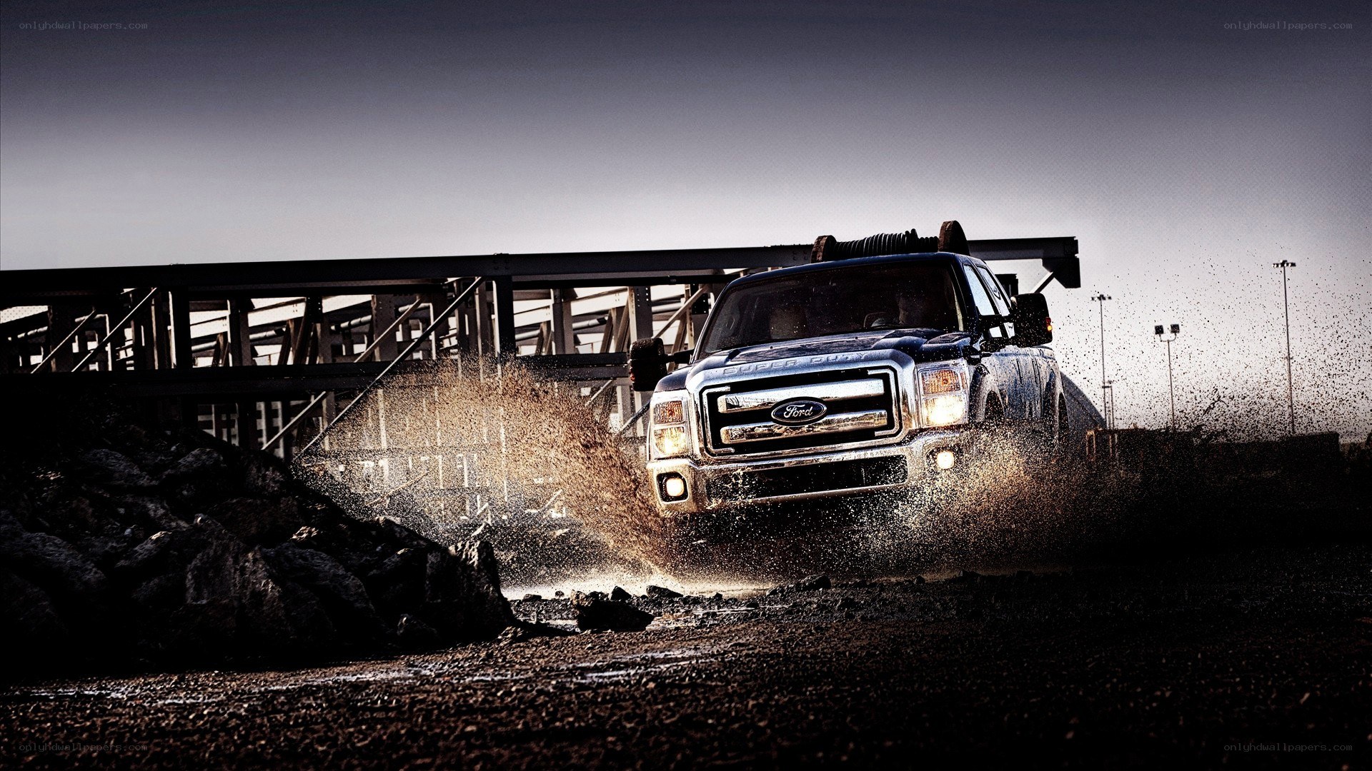 Ford truck splashing through mud