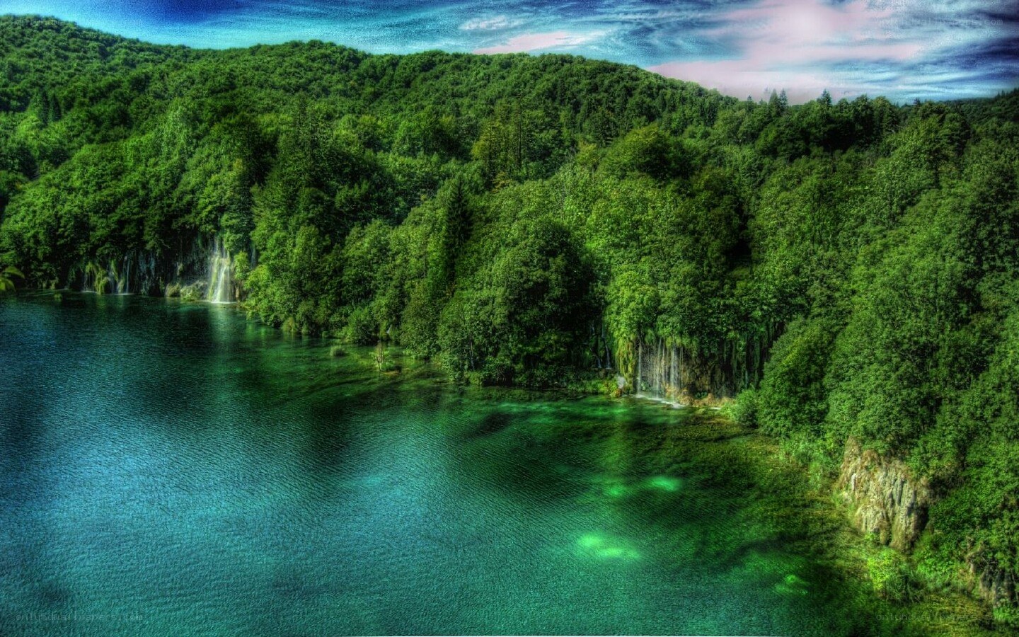 Forest lake with waterfalls