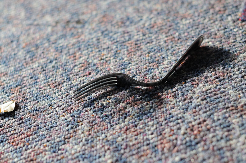 fork on textured carpet