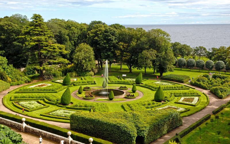 Formal Garden with Fountain — Green, Serene, Afternoon, Photograph, Hedges, Trees, Sea