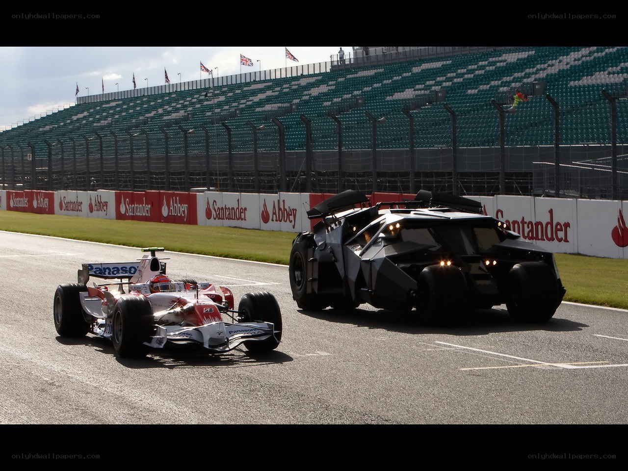 Formula 1 car and Batmobile on track