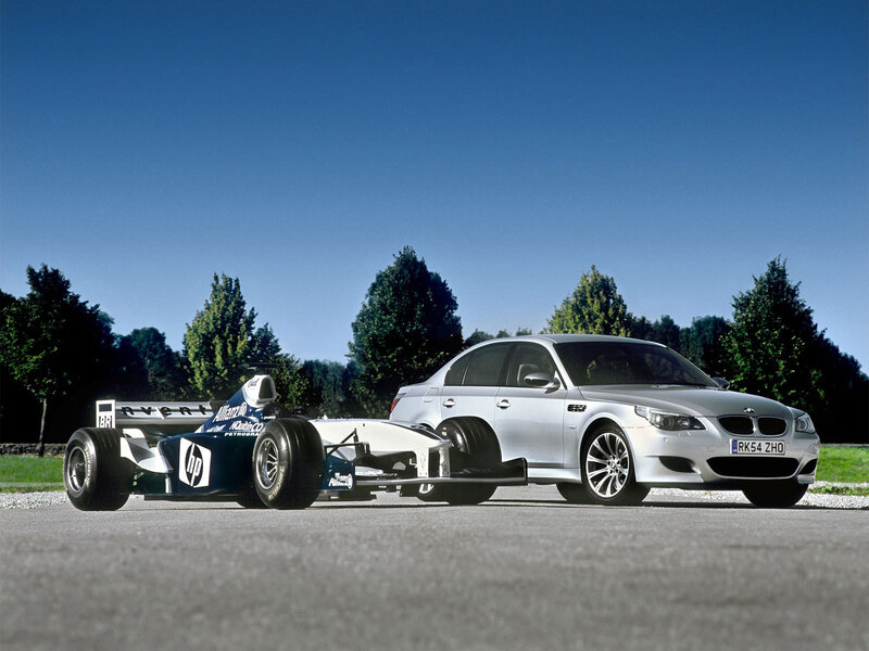 Formula 1 car and BMW M5
