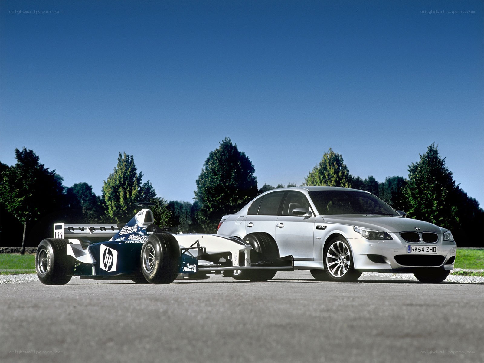 Formula 1 car and BMW M5