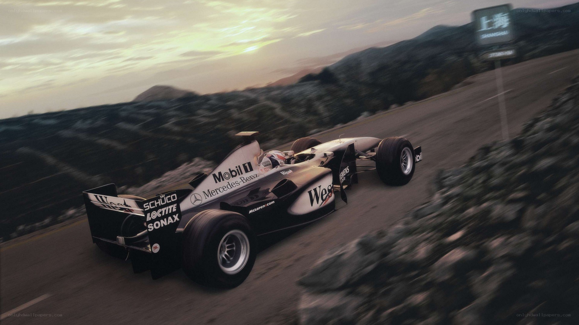 Formula 1 car on a winding road