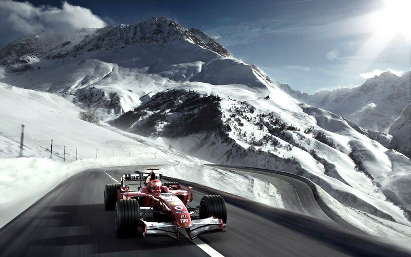 Formula 1 car on snowy mountain road