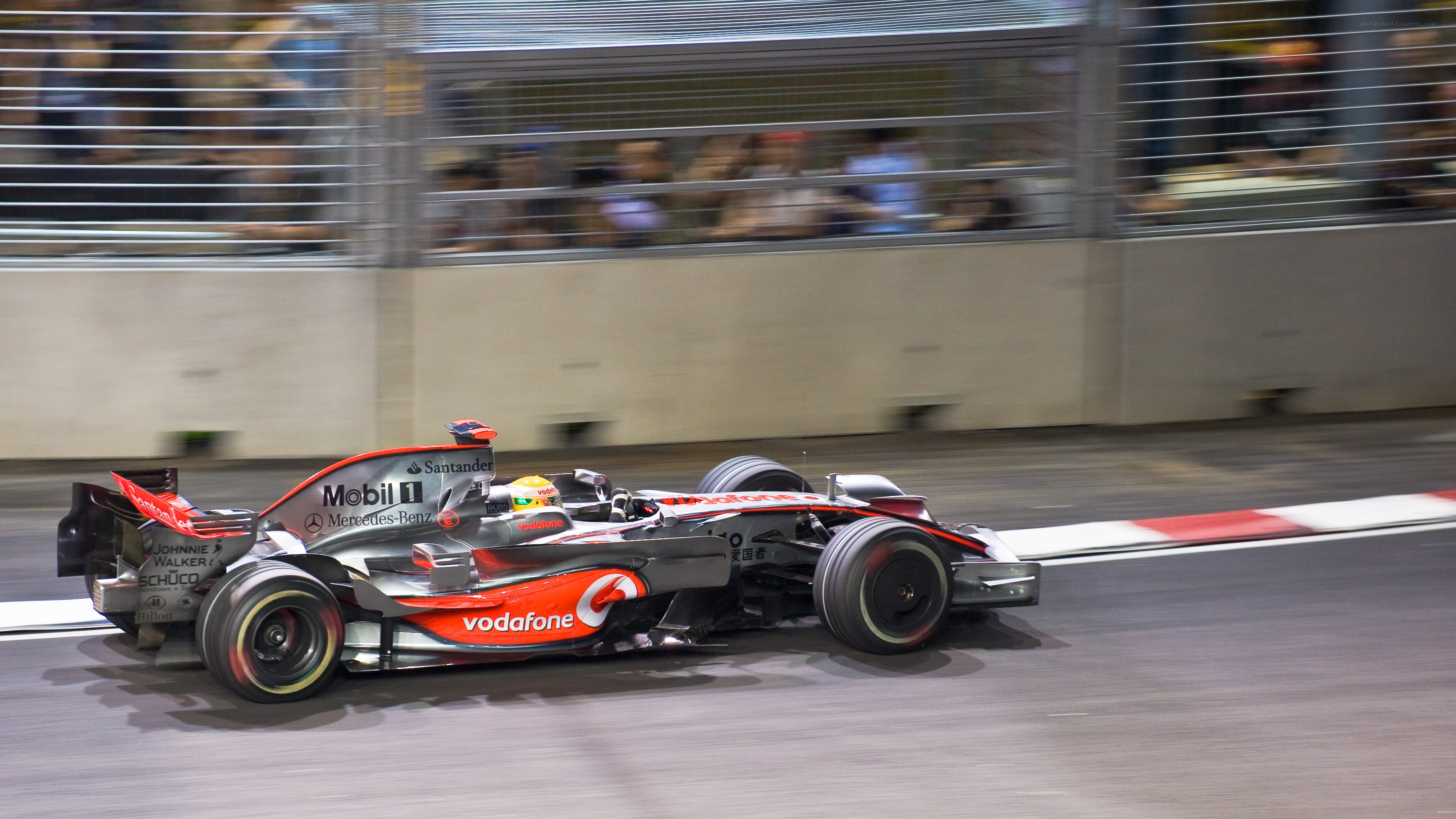 Formula 1 car racing at night