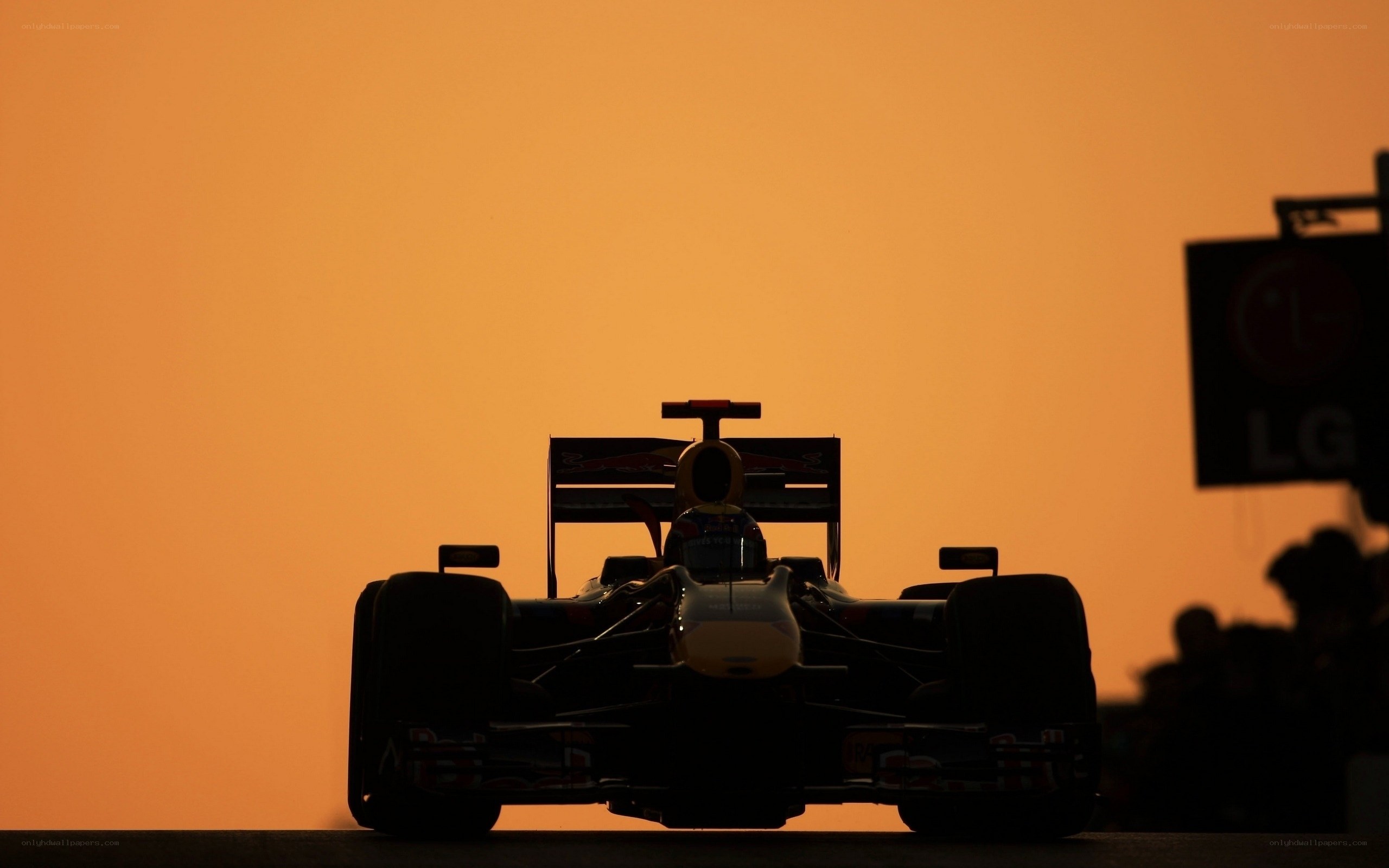 Formula 1 car silhouette at sunset