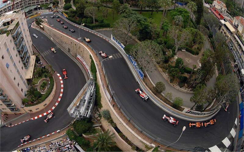 Formula 1 cars on a winding track
