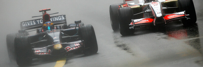 Formula 1 cars racing in rain