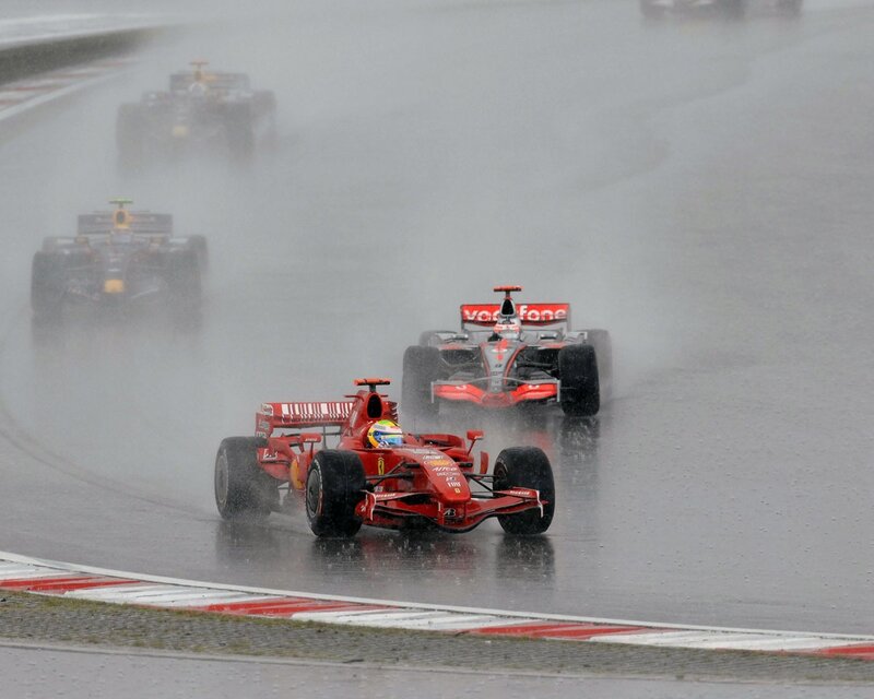 Formula 1 cars racing in rain
