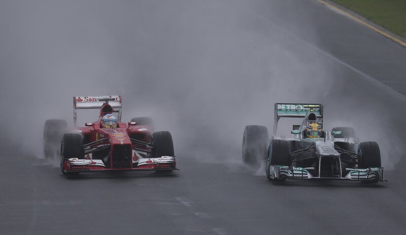 Formula 1 cars racing in rain