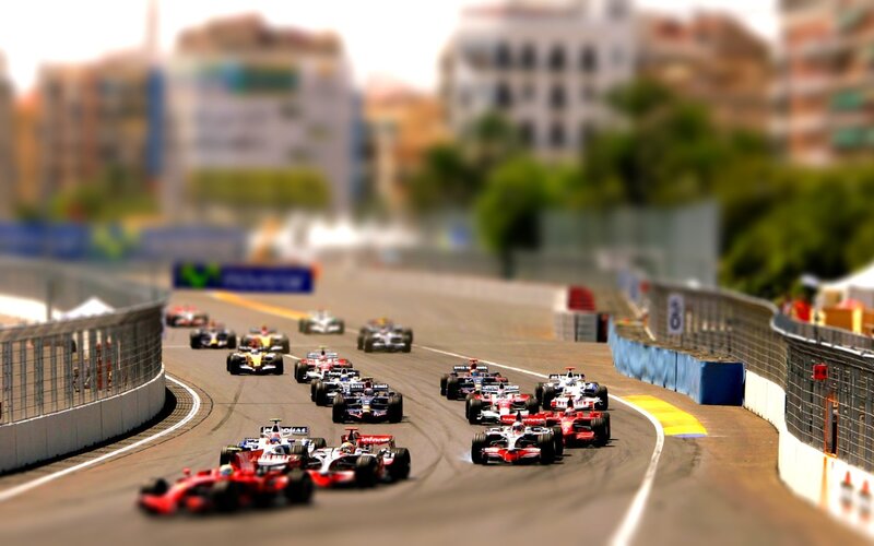 Formula 1 cars racing on a track
