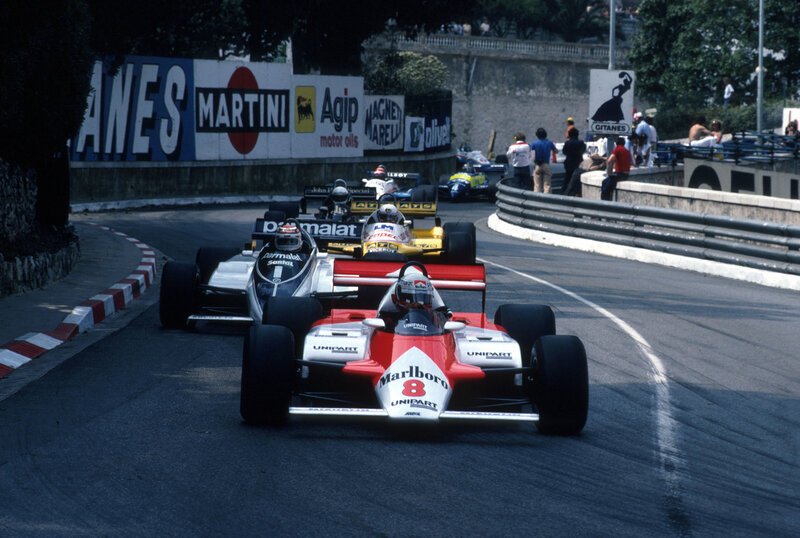 Formula 1 cars racing on a track