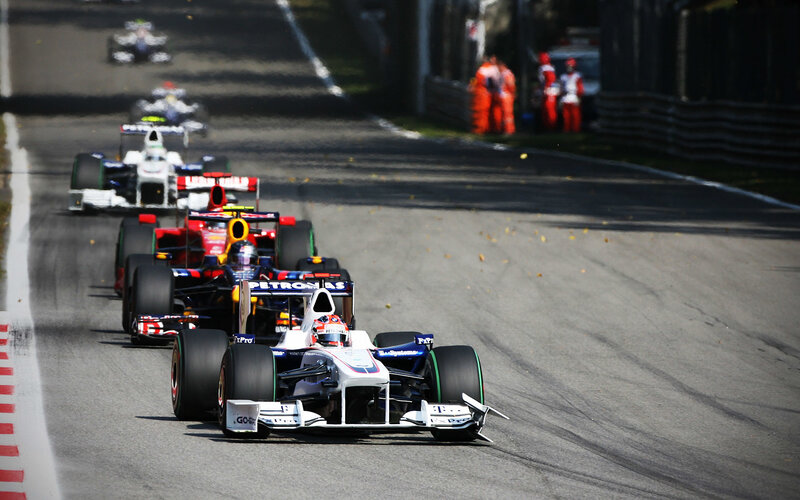 Formula 1 cars racing on track