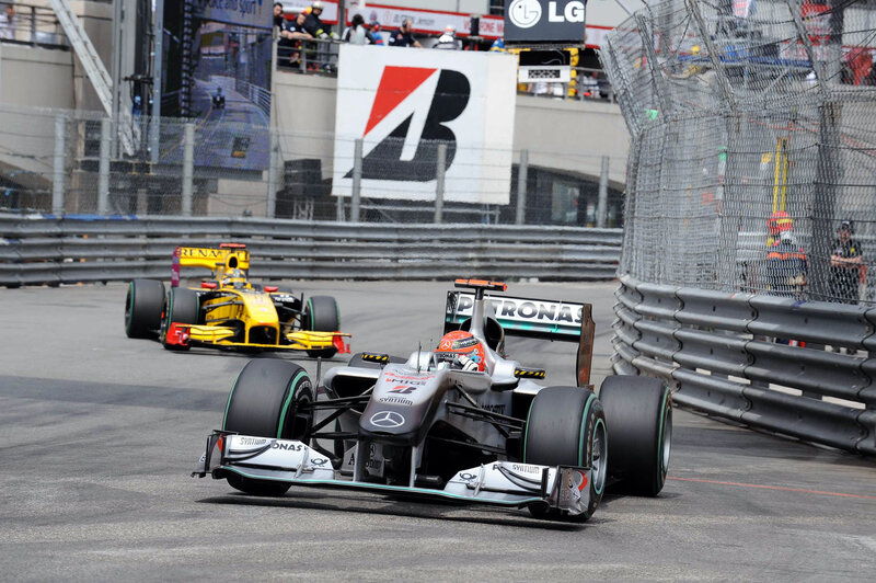 Formula 1 cars racing on track