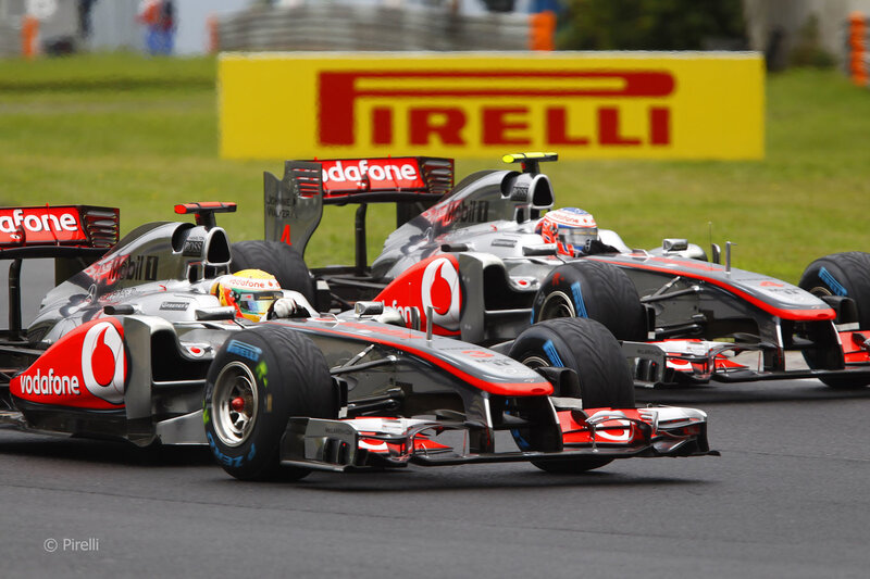 Formula 1 cars racing on track