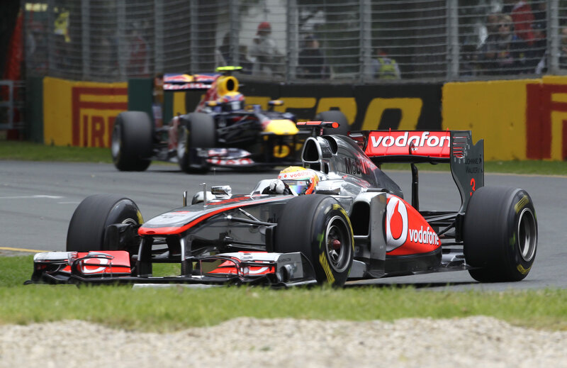 Formula 1 cars racing on track