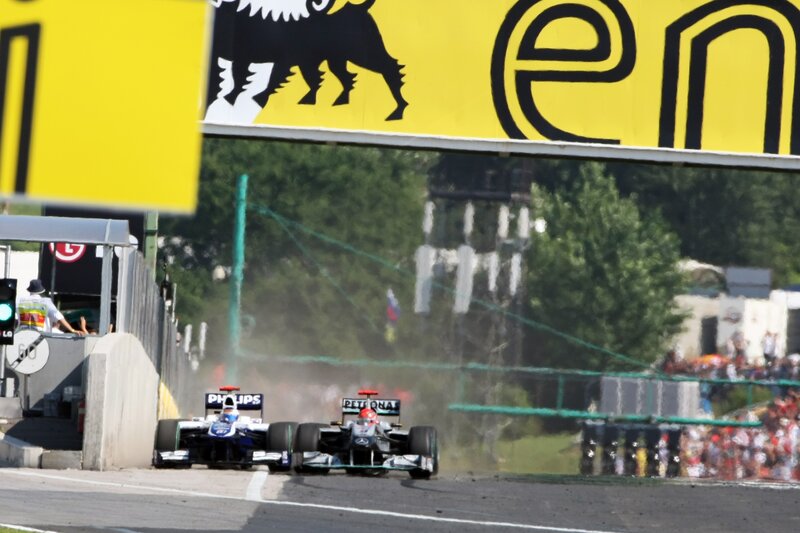 Formula 1 cars racing on track