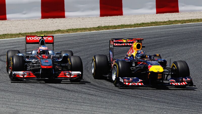 Formula 1 cars racing on track