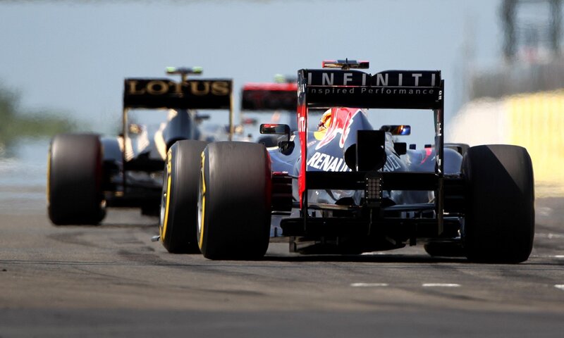 Formula 1 cars racing on track