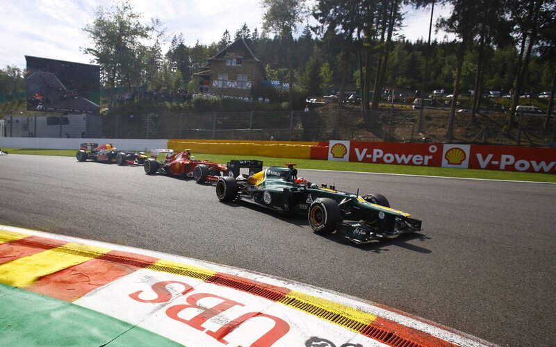 Formula 1 cars racing on track