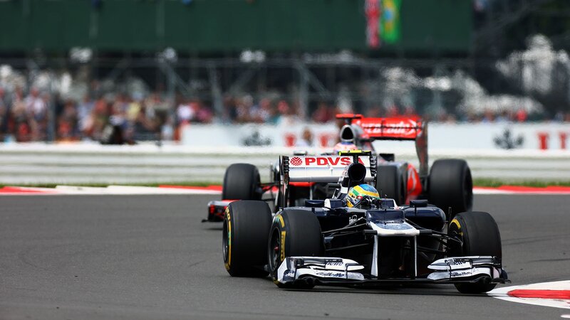 Formula 1 cars racing on track