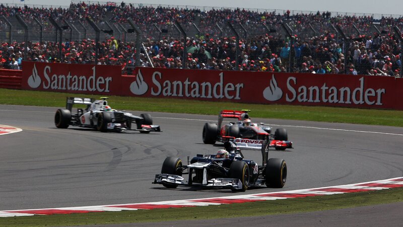 Formula 1 cars racing on track