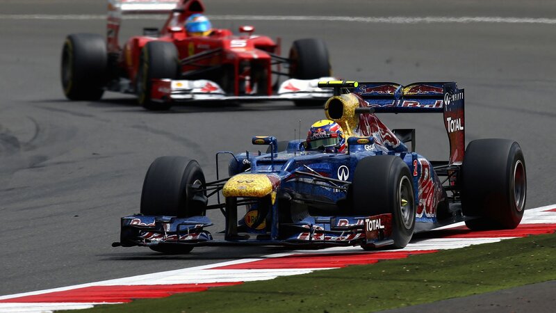 Formula 1 cars racing on track