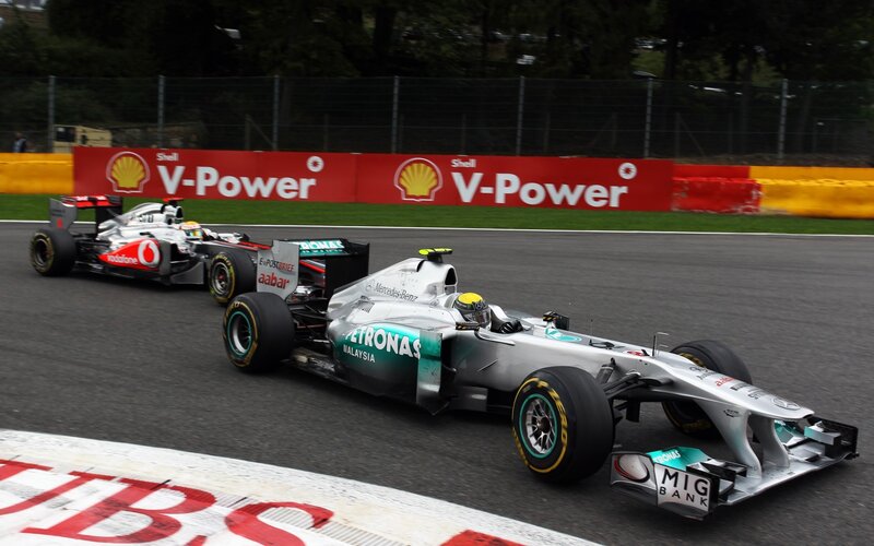 Formula 1 cars racing on track