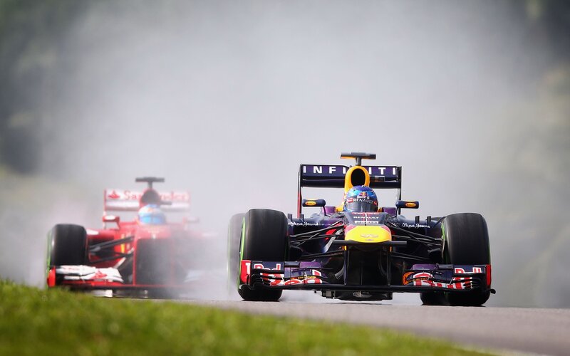 Formula 1 cars racing on track