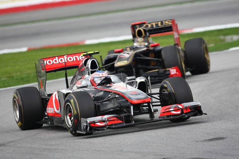 Formula 1 cars racing on track