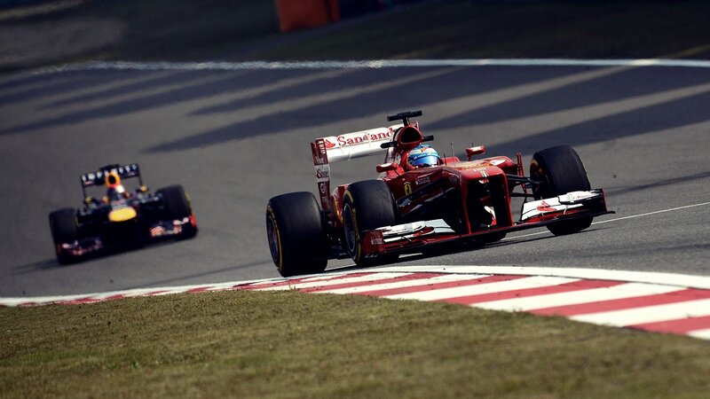 Formula 1 cars racing on track