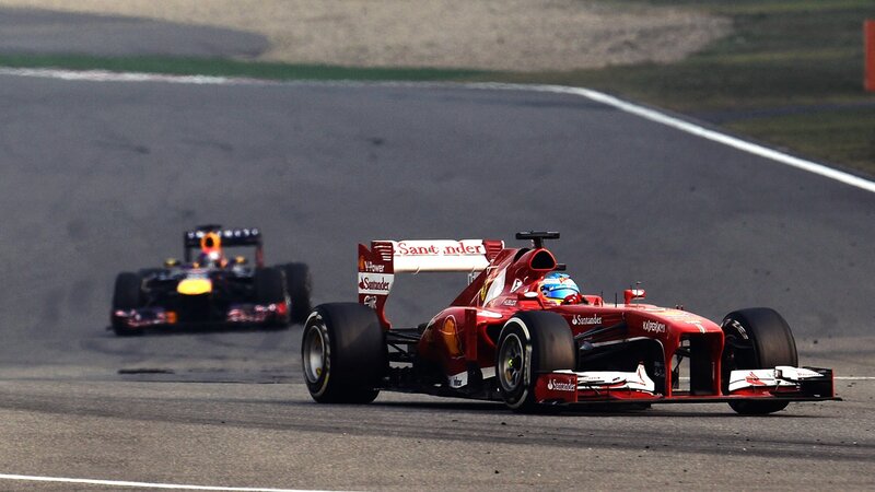 Formula 1 cars racing on track