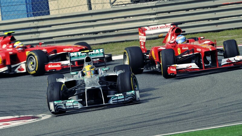 Formula 1 cars racing on track