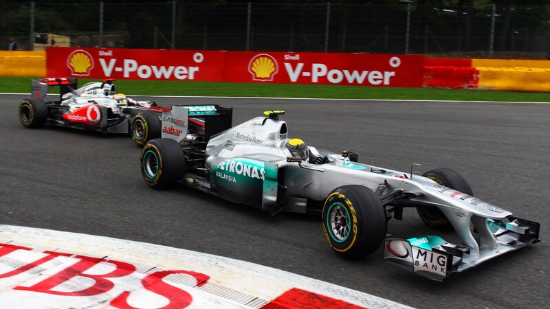 Formula 1 cars racing on track