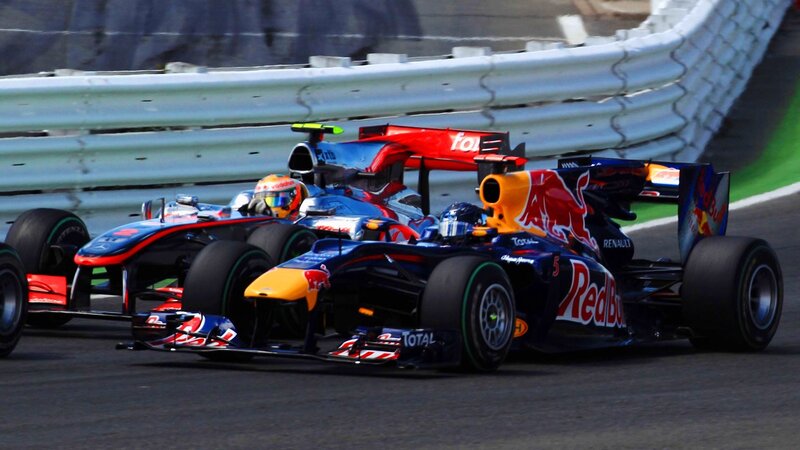 Formula 1 cars racing on track