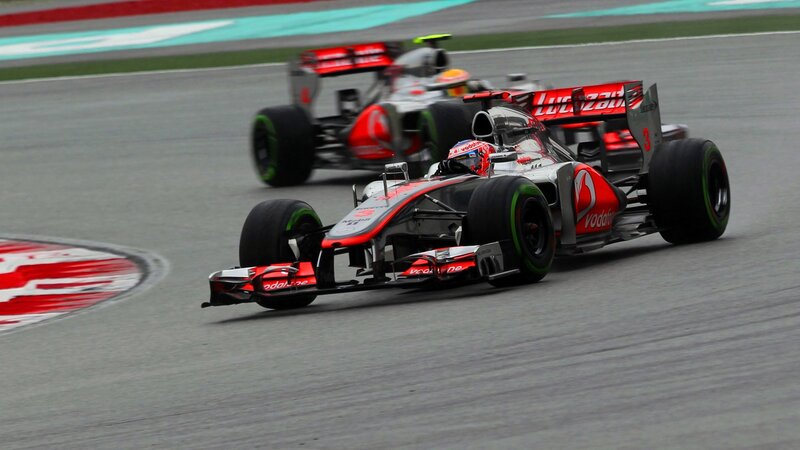 Formula 1 cars racing on track