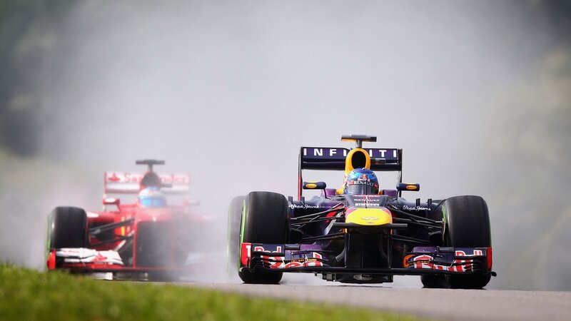 Formula 1 cars racing on track