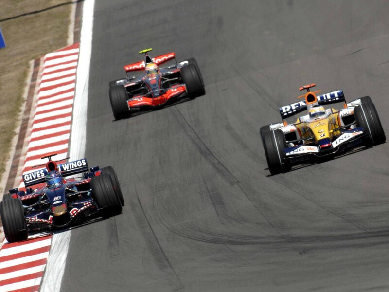 Formula 1 cars racing on track