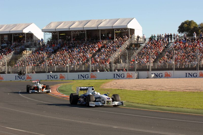 Formula 1 cars racing on track