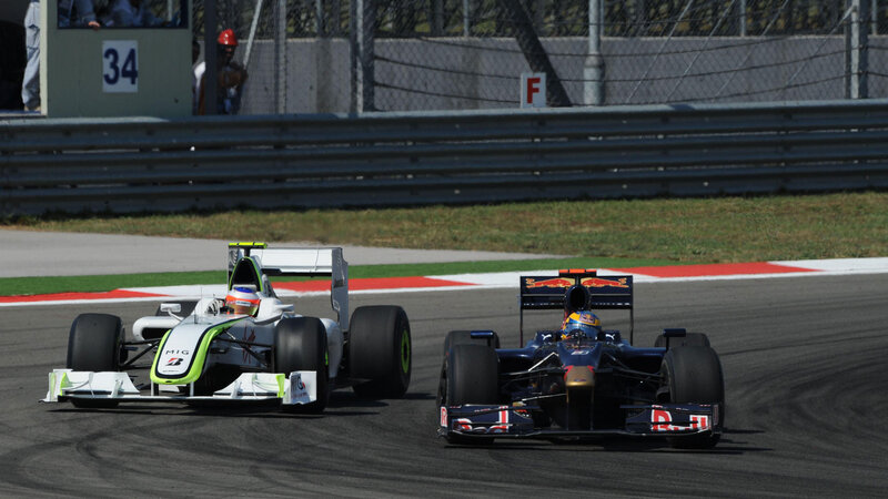 Formula 1 cars racing on track