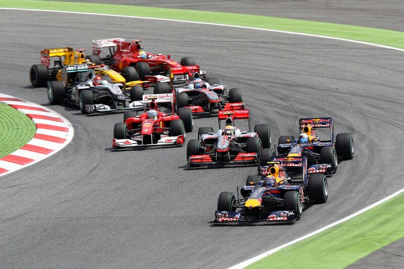 Formula 1 cars racing on track