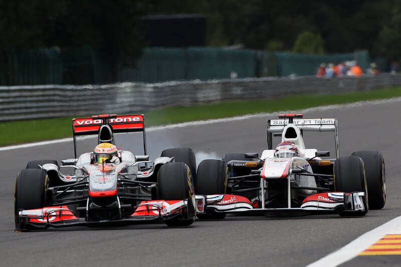 Formula 1 cars racing on track