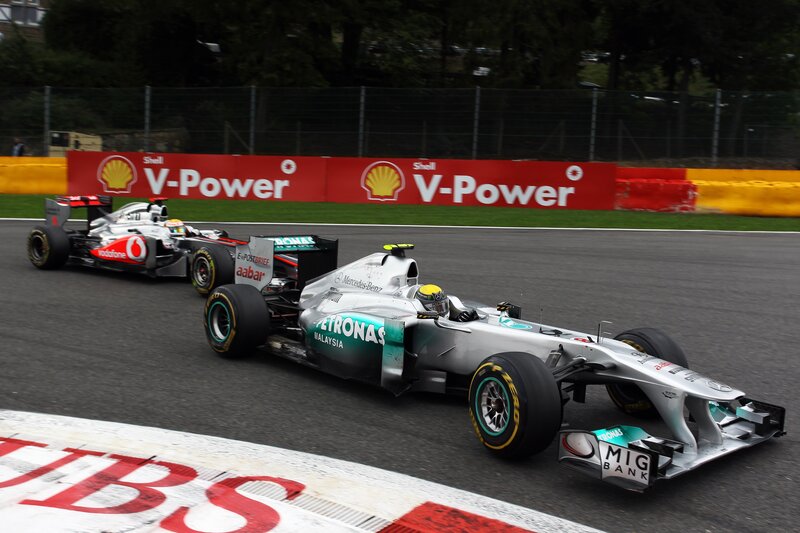 Formula 1 cars racing on track