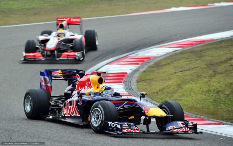 Formula 1 cars racing on track