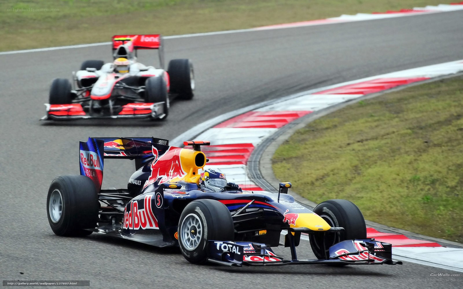 Formula 1 cars racing on track