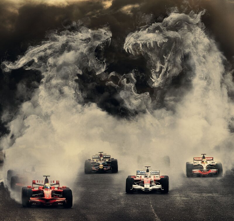 Formula 1 cars racing with smoke monsters