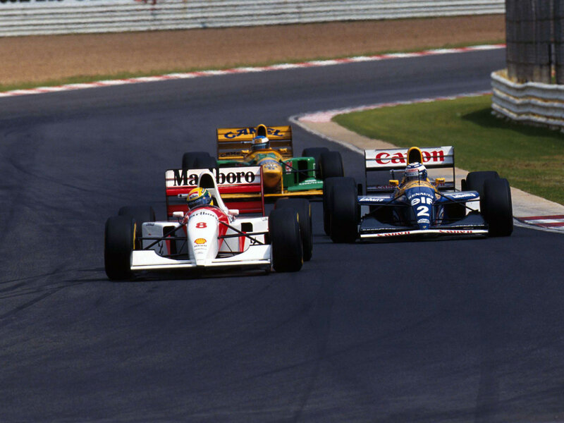 Formula 1 race cars on track