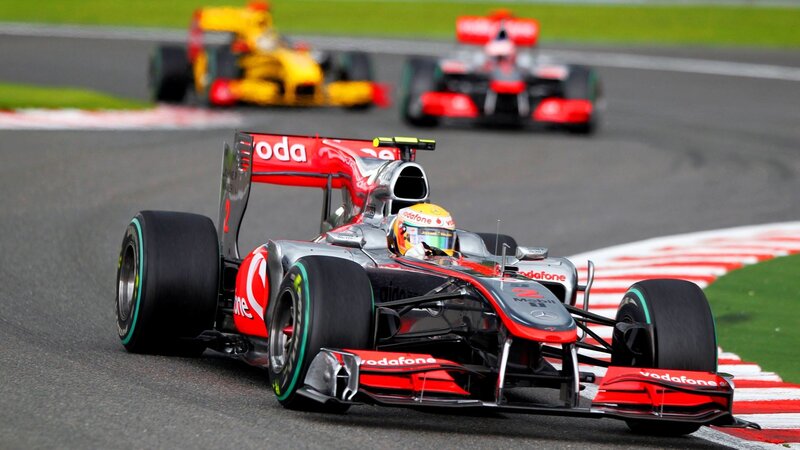 Formula 1 race cars on track